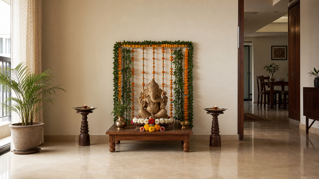 Ganpati setup with a clay idol, marigold backdrop and earthen diyas