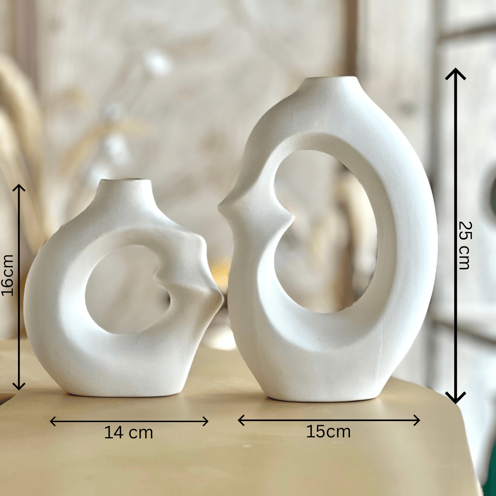 Modern Embrace Ceramic Vase Set showcasing abstract sculptures with fluid curves and soft matte white finish.