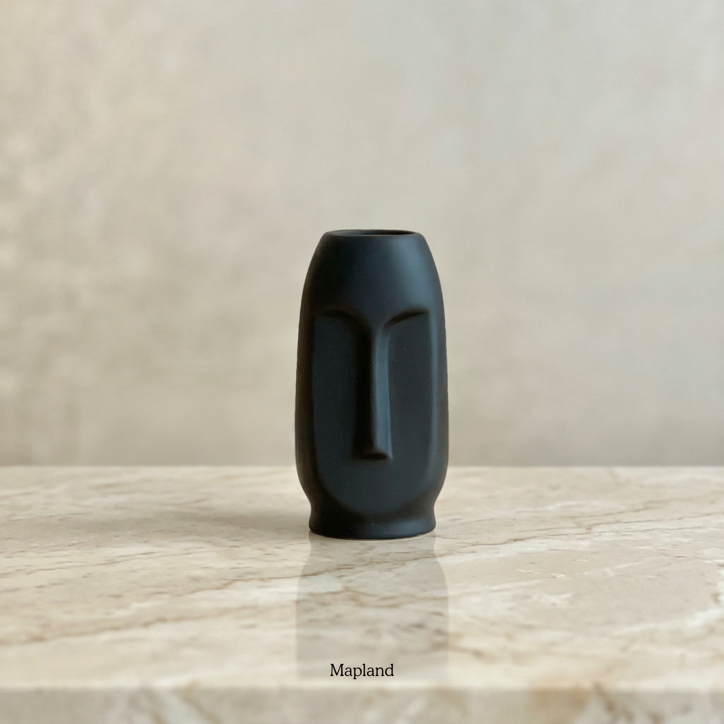 Moai face ceramic vase in charcoal black — handmade ceramic vase | Mapland Design Studio