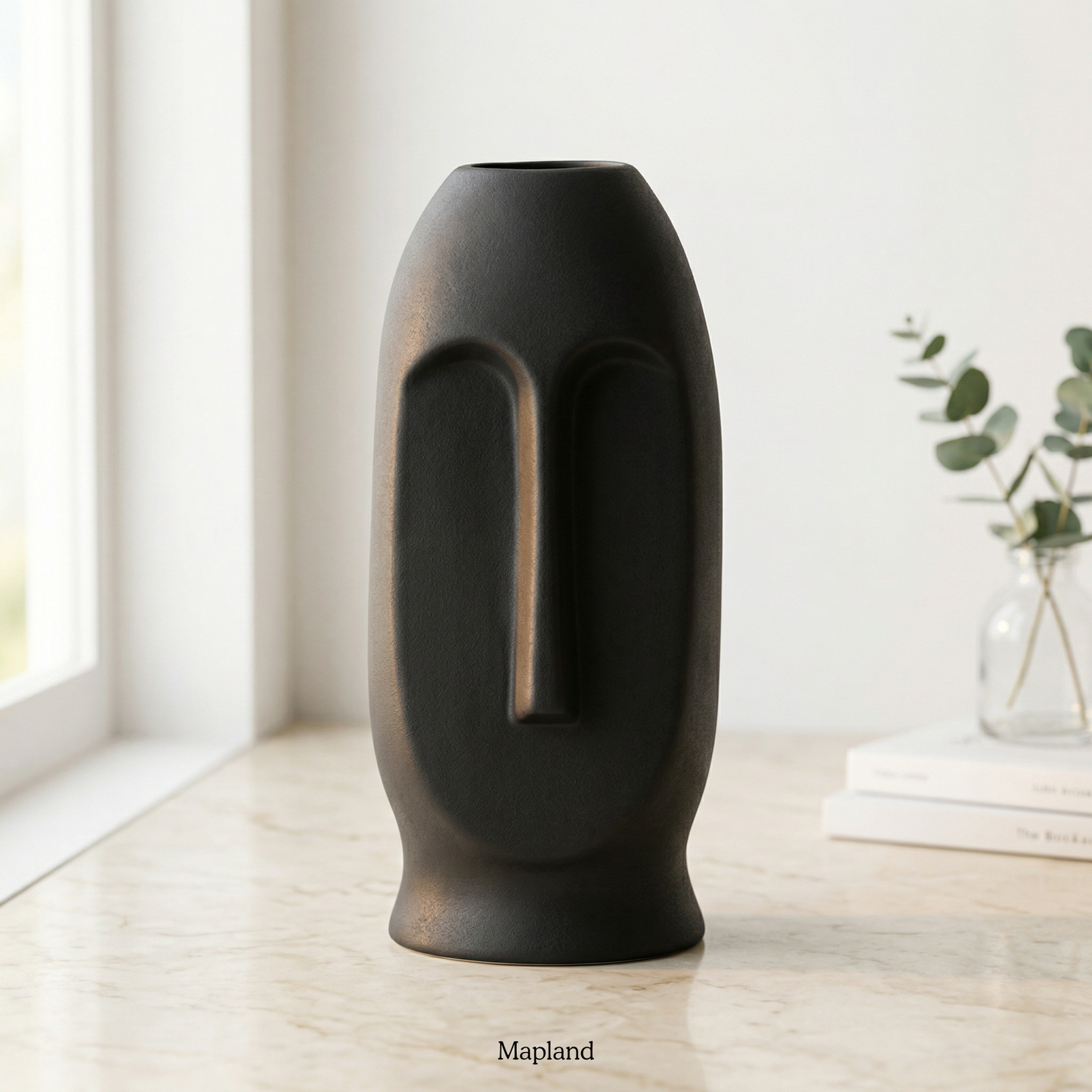 Large Moai face ceramic vase in charcoal black — handmade ceramic vase | Mapland Design Studio