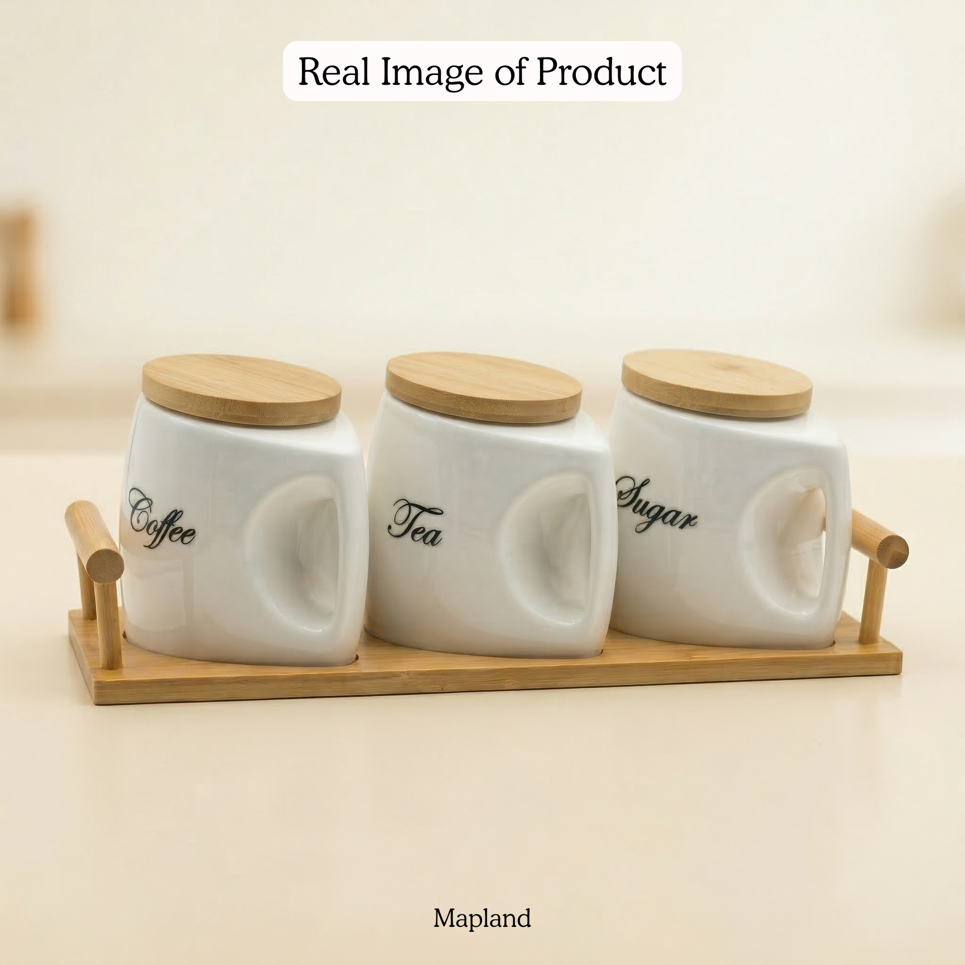 Set of three ceramic containers labeled 'Coffee', 'Tea', and 'Sugar' with wooden lids on a wooden tray.