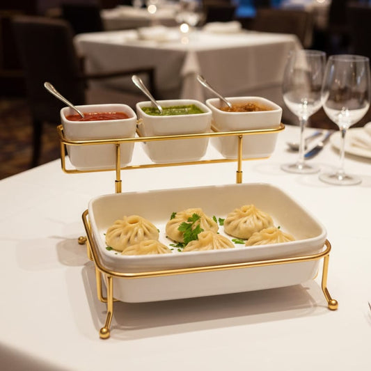 Dessert platter with small dishes and spoons on a table in a restaurant setting.